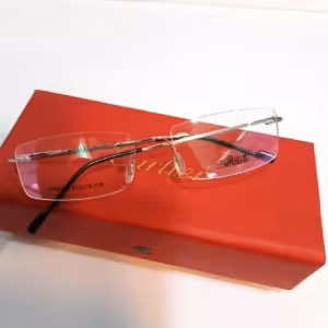 عینک طبی بی فریم دارای رنگ بندی مشکی طلایی نوک مدادی