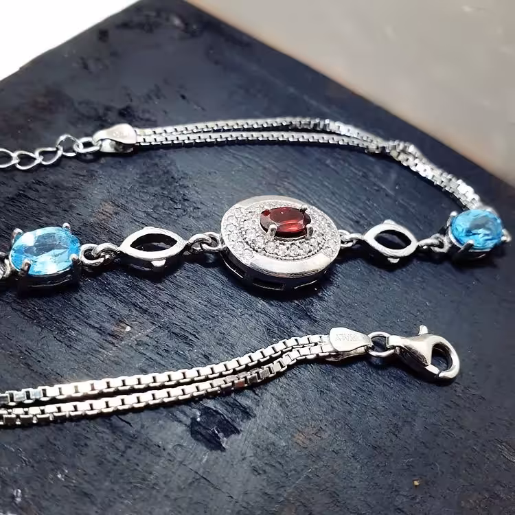 دستبند نقره زیبای زنانه با نگینهای یاقوت سرخ و توپاز سوییسی اصل