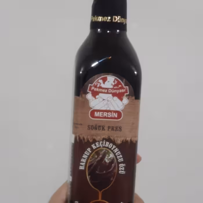 میوه خرنوب عصاره شهد و شیره شربت غلیظ میوه درخت مدیترانه ای