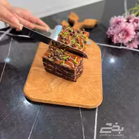 کیک بر دسته چوبی طلایی نقره ای