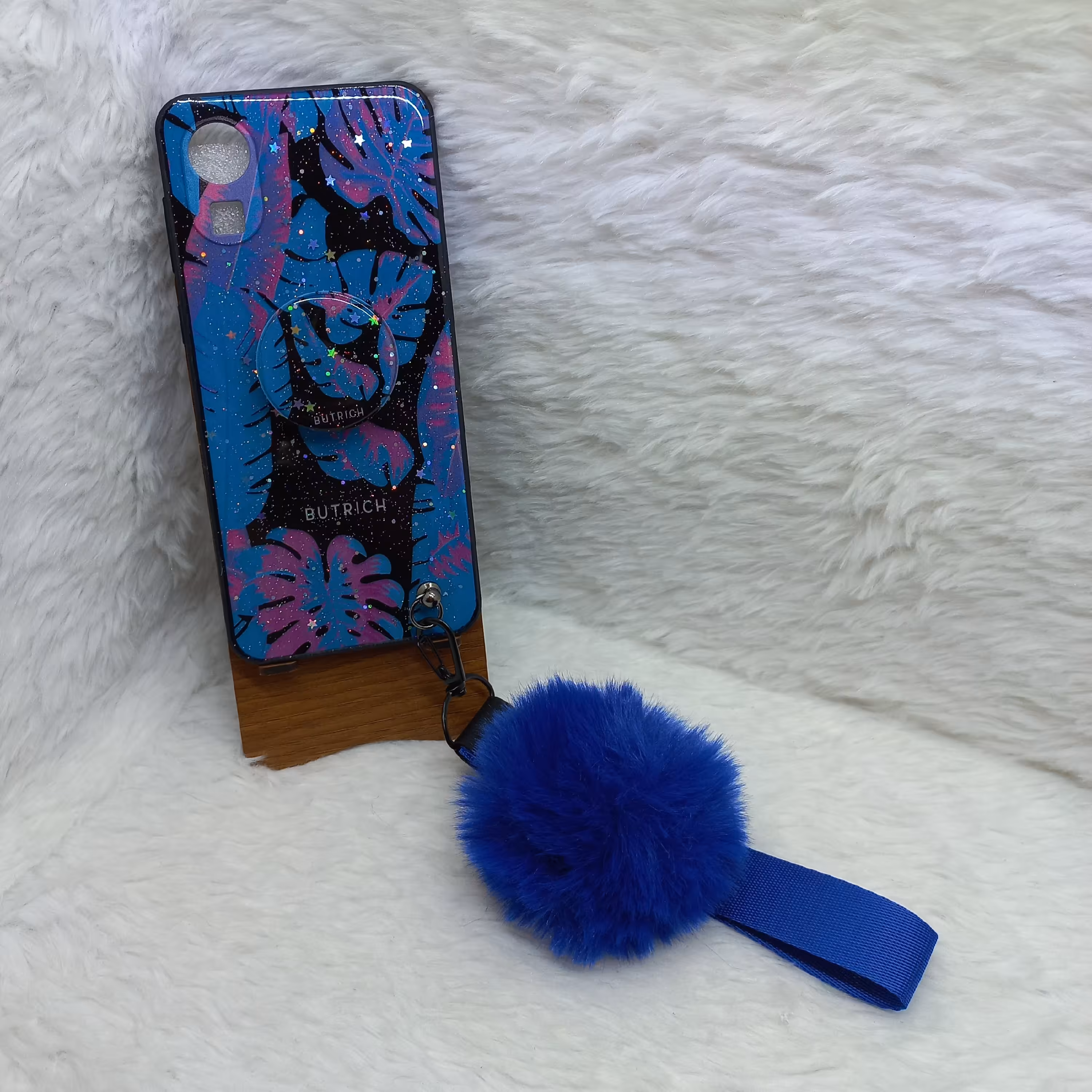 گارد (قاب) گوشی دخترانه A03core مدل پام پام به همراه بند پام و پاپ سوکت طرح برگ آبی مناسب گوشی Samsung A03core