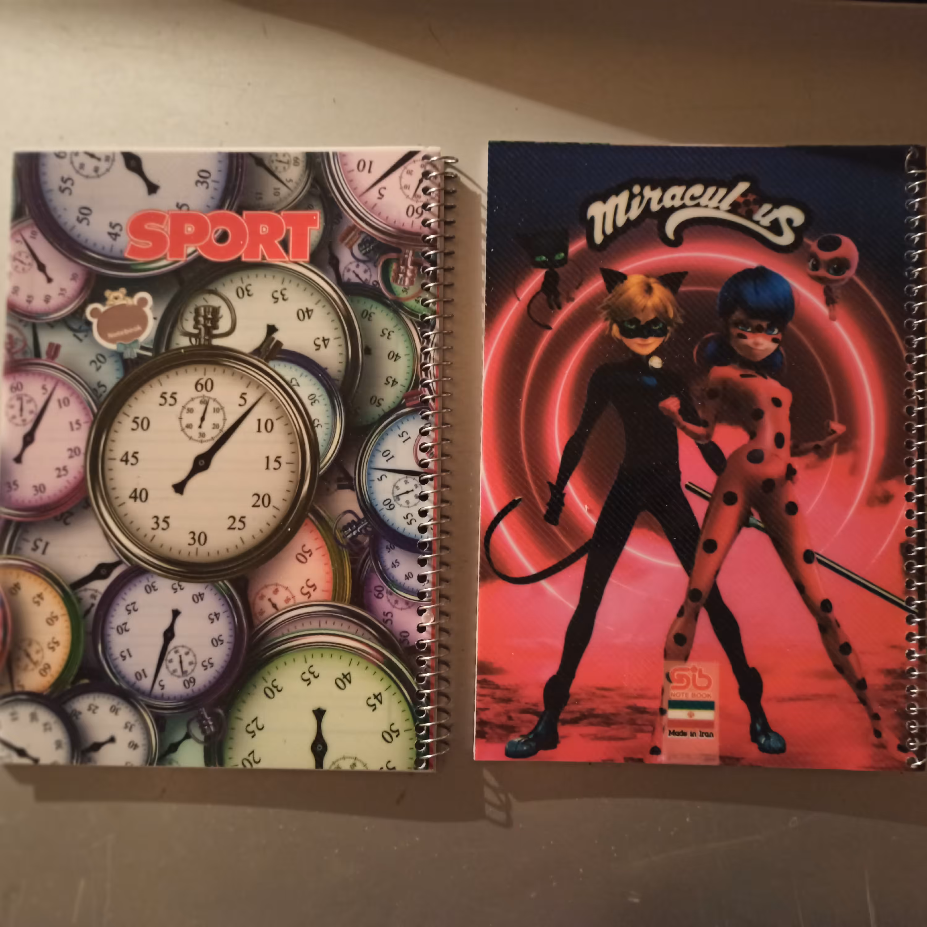 دفترپنجاه برگ سیمی (نقاشی وخط دار)در بسته های ده عددی،در طرح های مختلف 