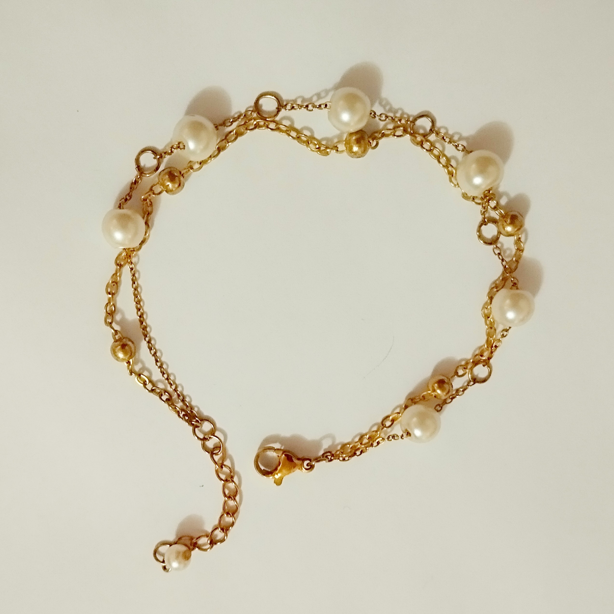 دستبند دولاین مرواریدی وتوپی  استیل رنگ ثابت 