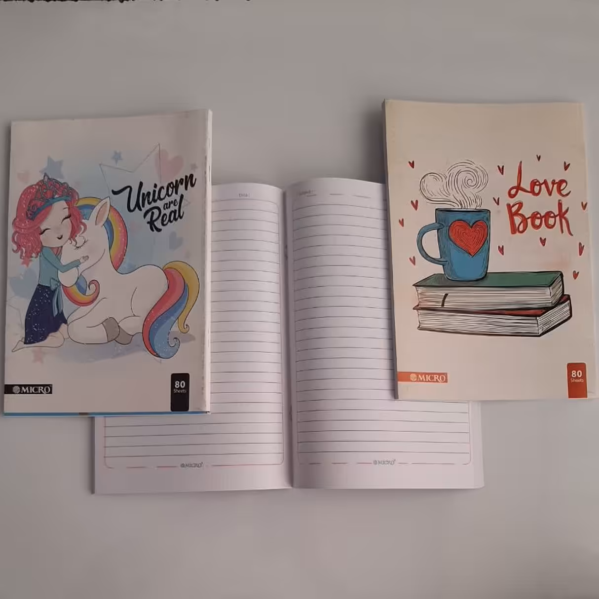 دفتر منگنه ای 80برگ کیفیت عالی و خطوط پر رنگ در طرح های متنوع پسرانه و دخترانه 