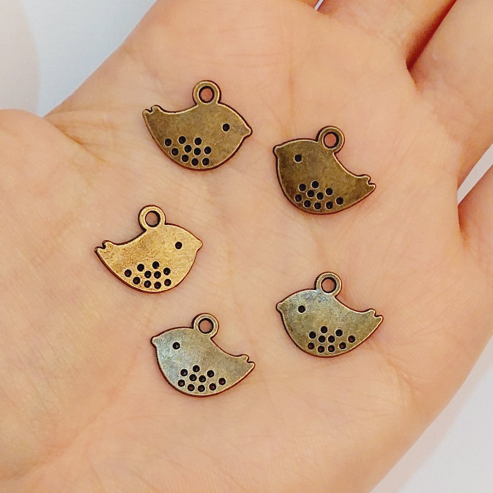 خرجکار برنز 10گرمی آویز گنجشک(شامل10عدد)طول1سانت ونیم