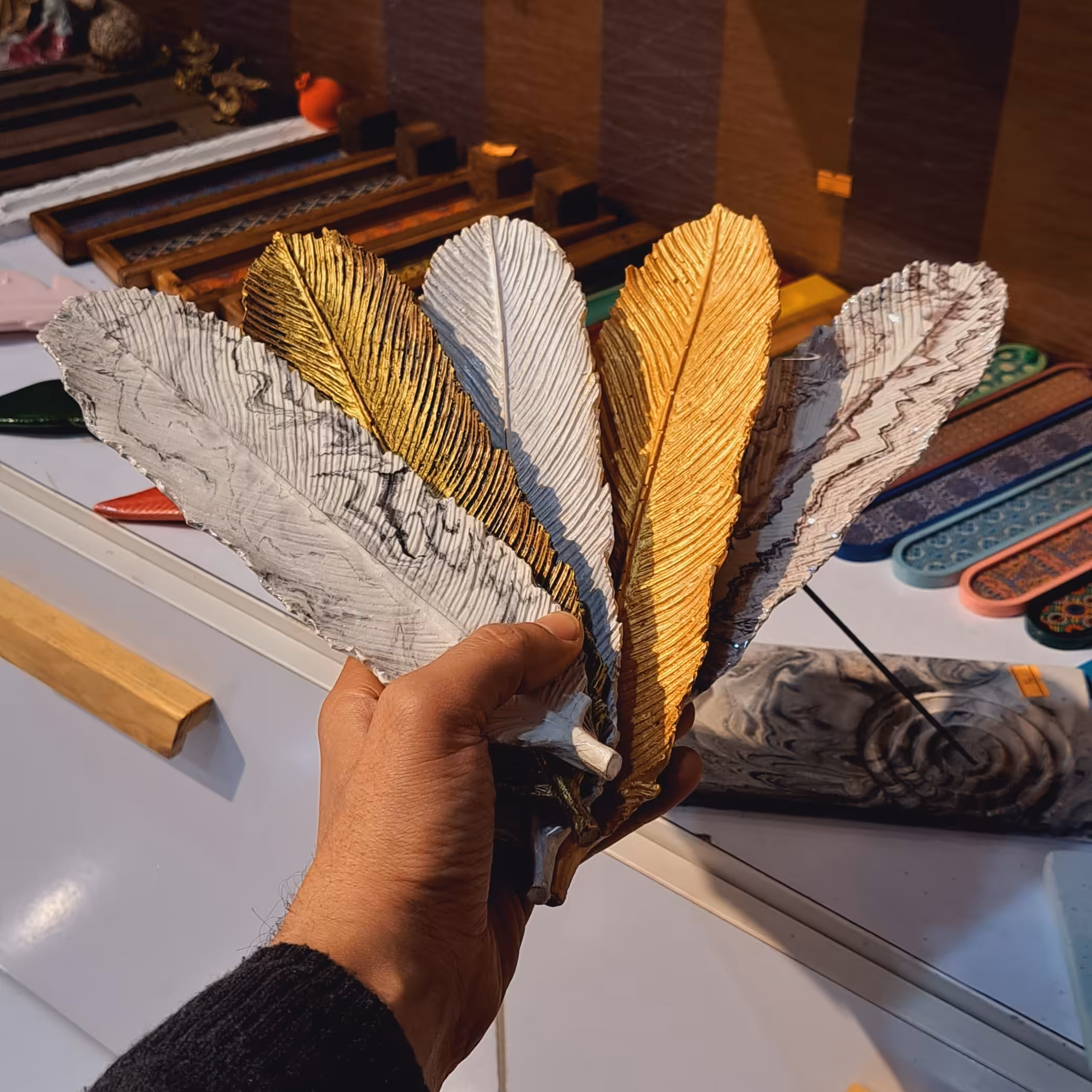 جاعود شاخه ای جاعودی دستساز جا عودی پلی استر جاعودی رزینی جاعودی برگ جاعودی ارزان فروشگاه سلما گالری در باسلام جاعودی پر