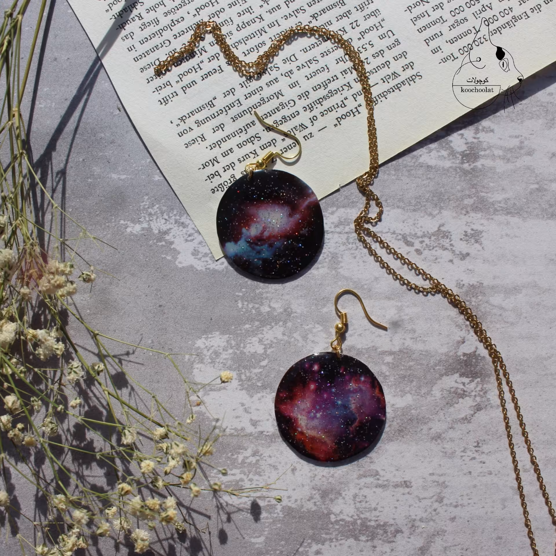 گوشواره آویزی طرح کهکشان صورتی