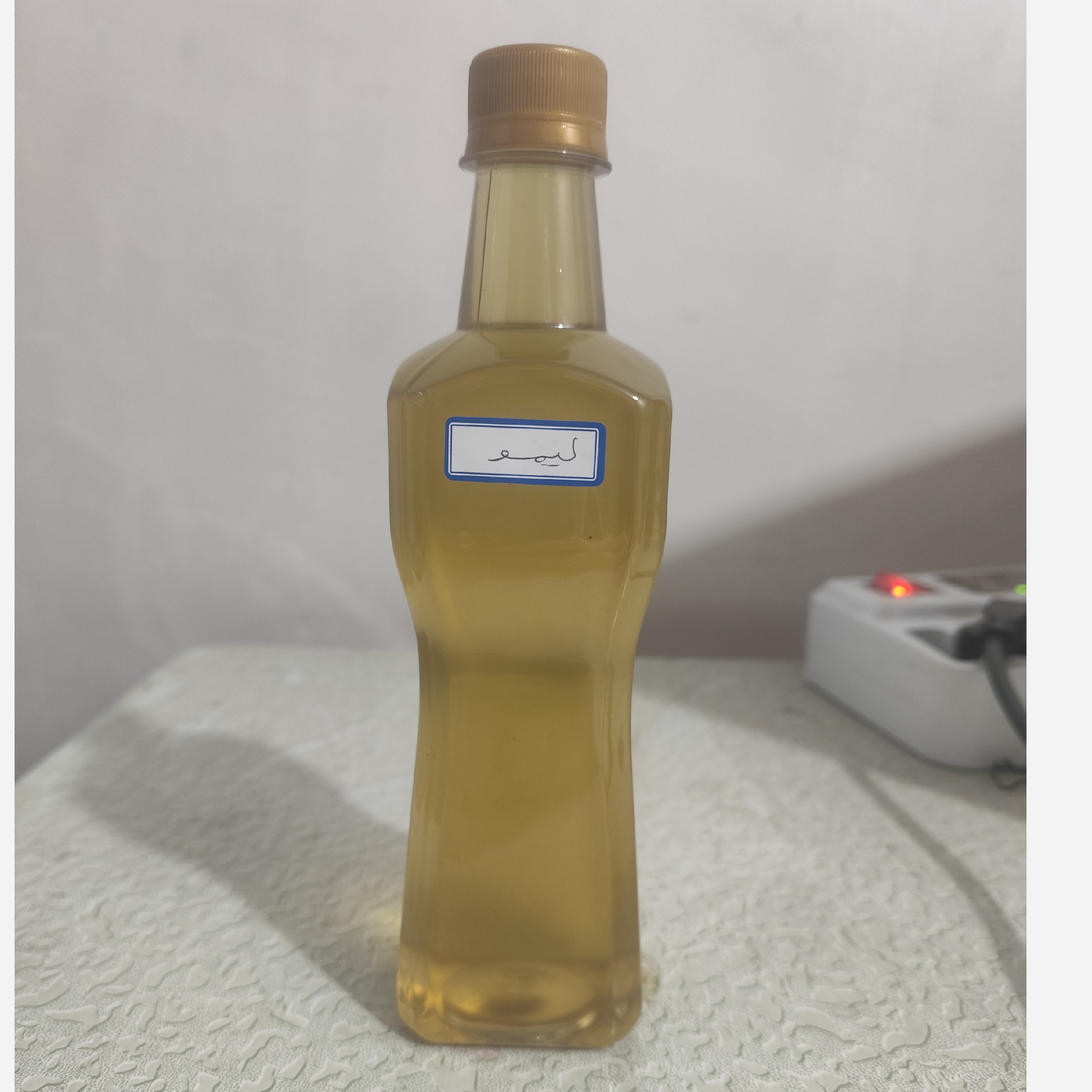 روغن لیمو اصل نیم لیتری (روشن کننده پوست - لک صورت - جوش صورت - آکنه - لک بارداری - ضدلک)