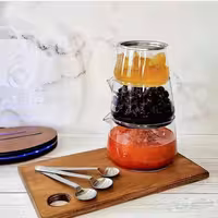 برج مرباخوری دارای سه طبقه و سه قاشق استیل و درب استیل جنس بدنه شیشه