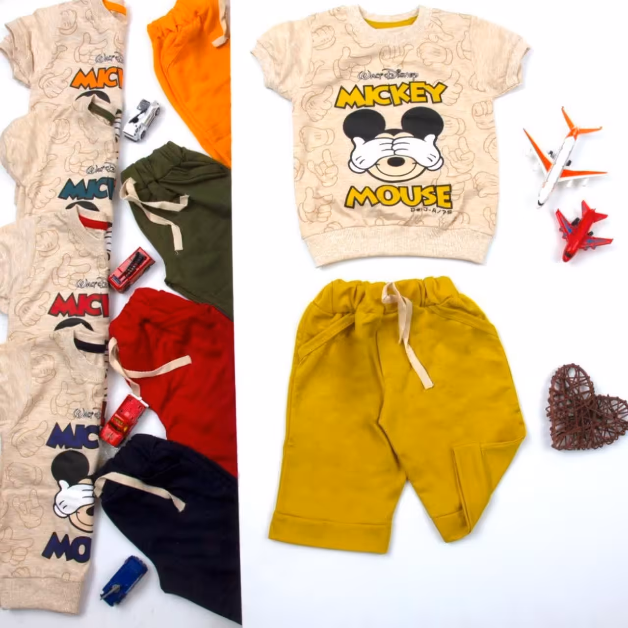 تیشرت و شلوارک پسرانه طرح میکی موس با طرح شیک سایز 40 تا 55 مناسب 1.5 تا 8 سال تکرنگ نارنجی با قیمت عالی 