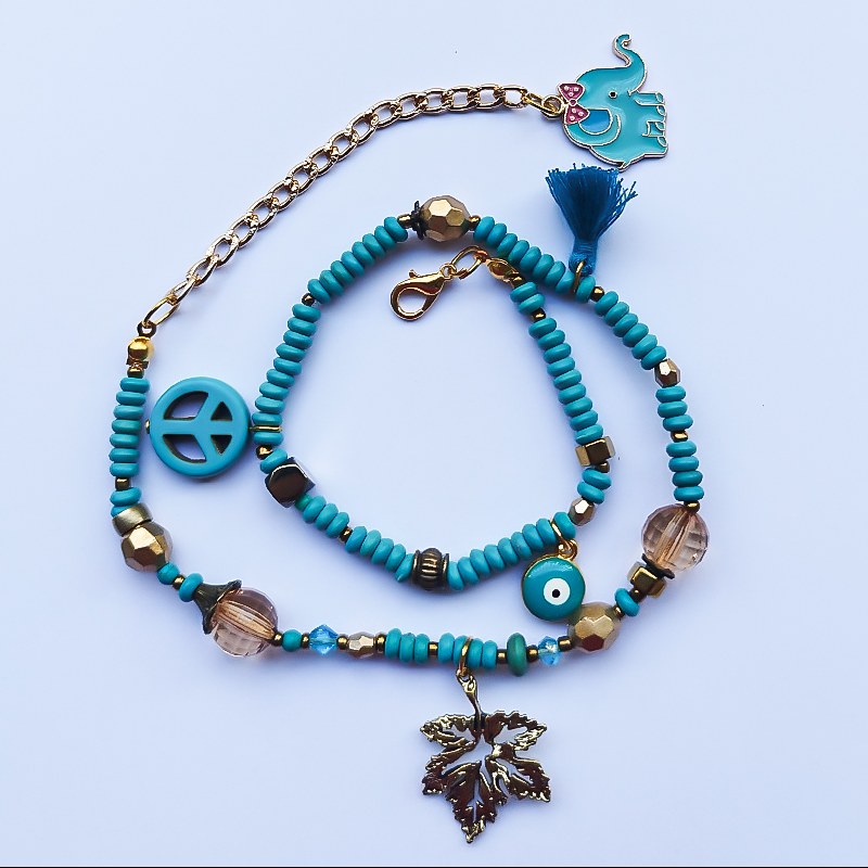 دستبند مدل مالدیو از گوهرهای پرانرژی و زیبایی همچون فیروزه، کریستال  و آویز زیبا