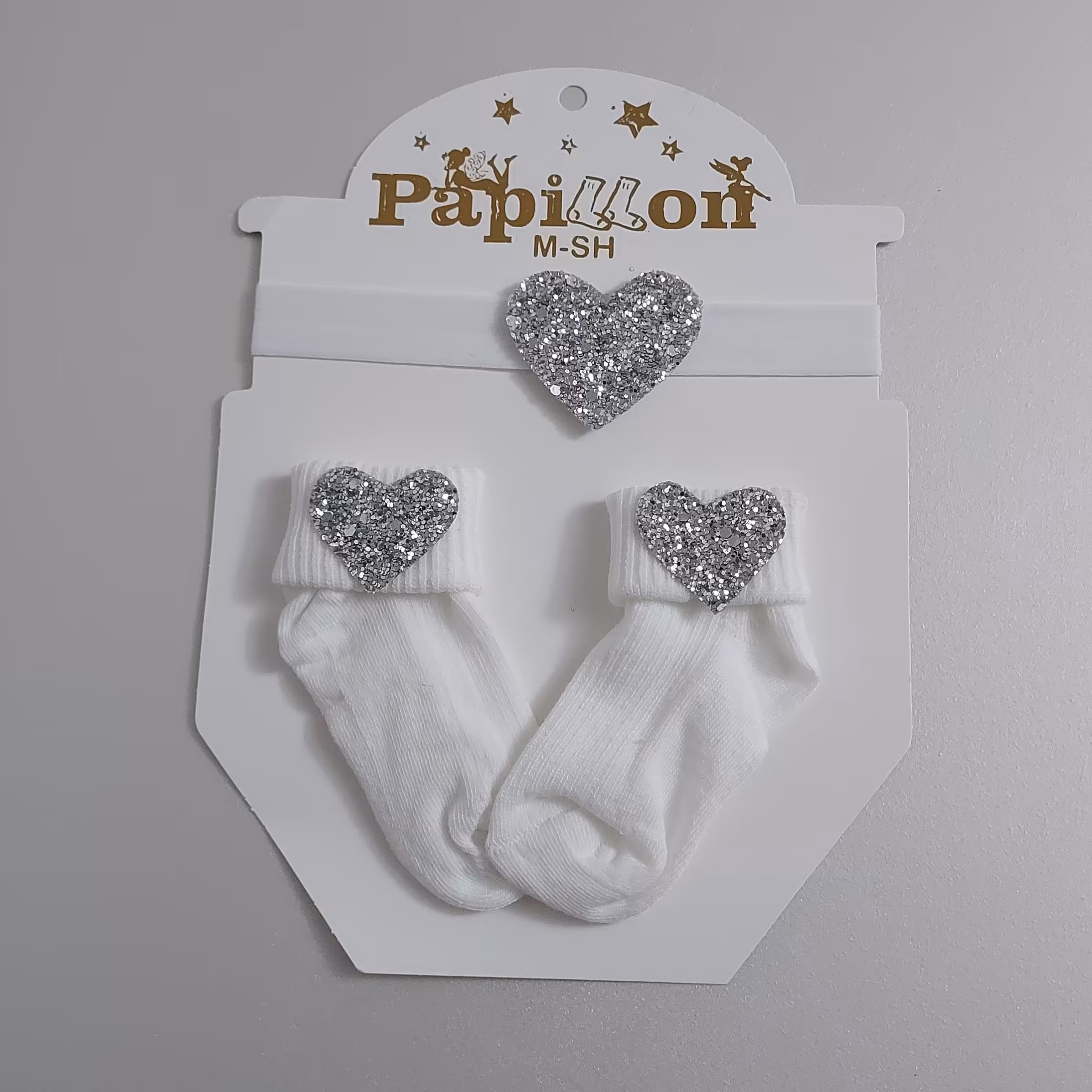 جوراب نوزادی بهمراه تل رنگ سفید 