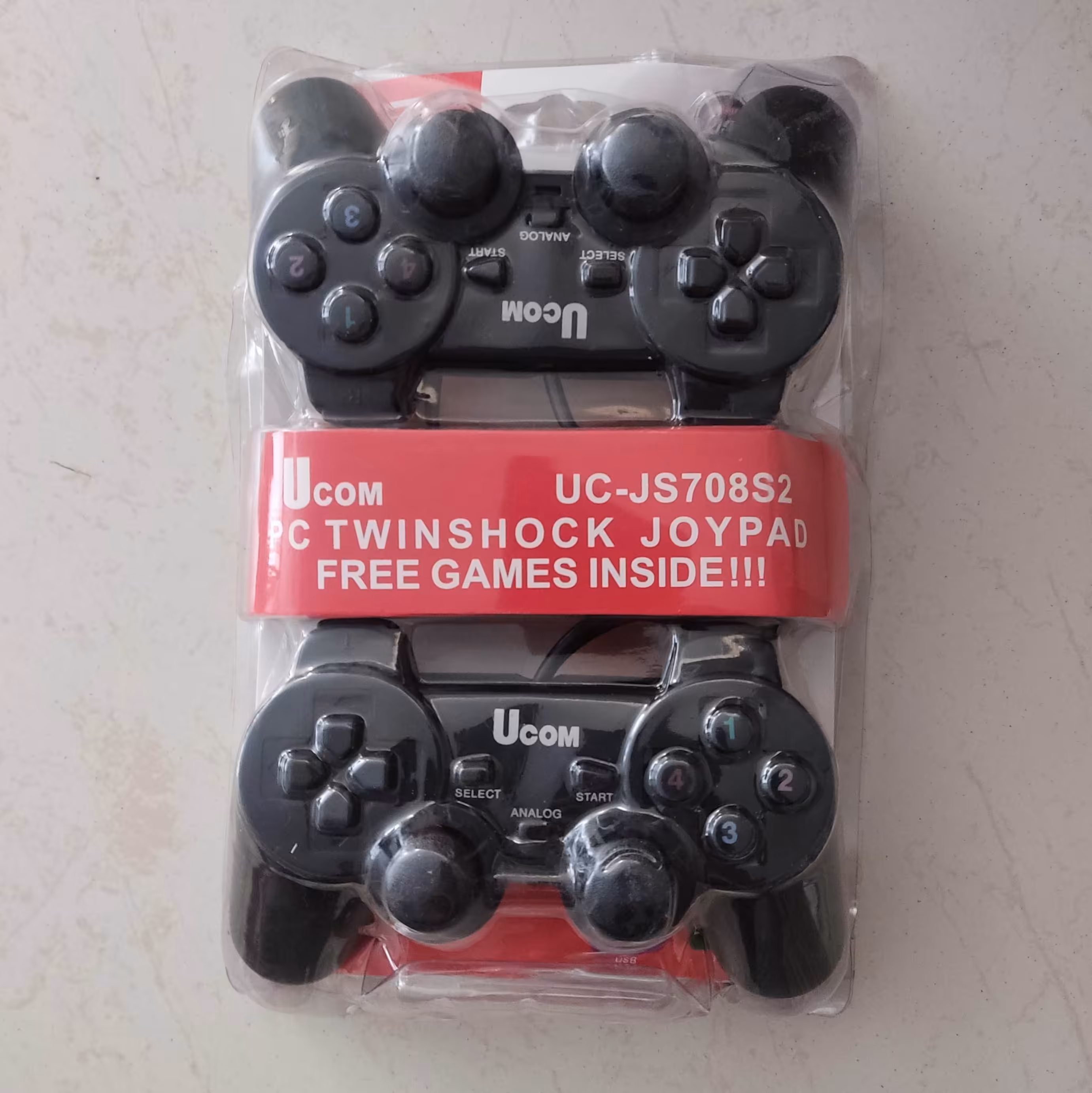 گیم پد کامپیوتر (دسته بازی کامپیوتر)
جفت شوک
مارک UCOM