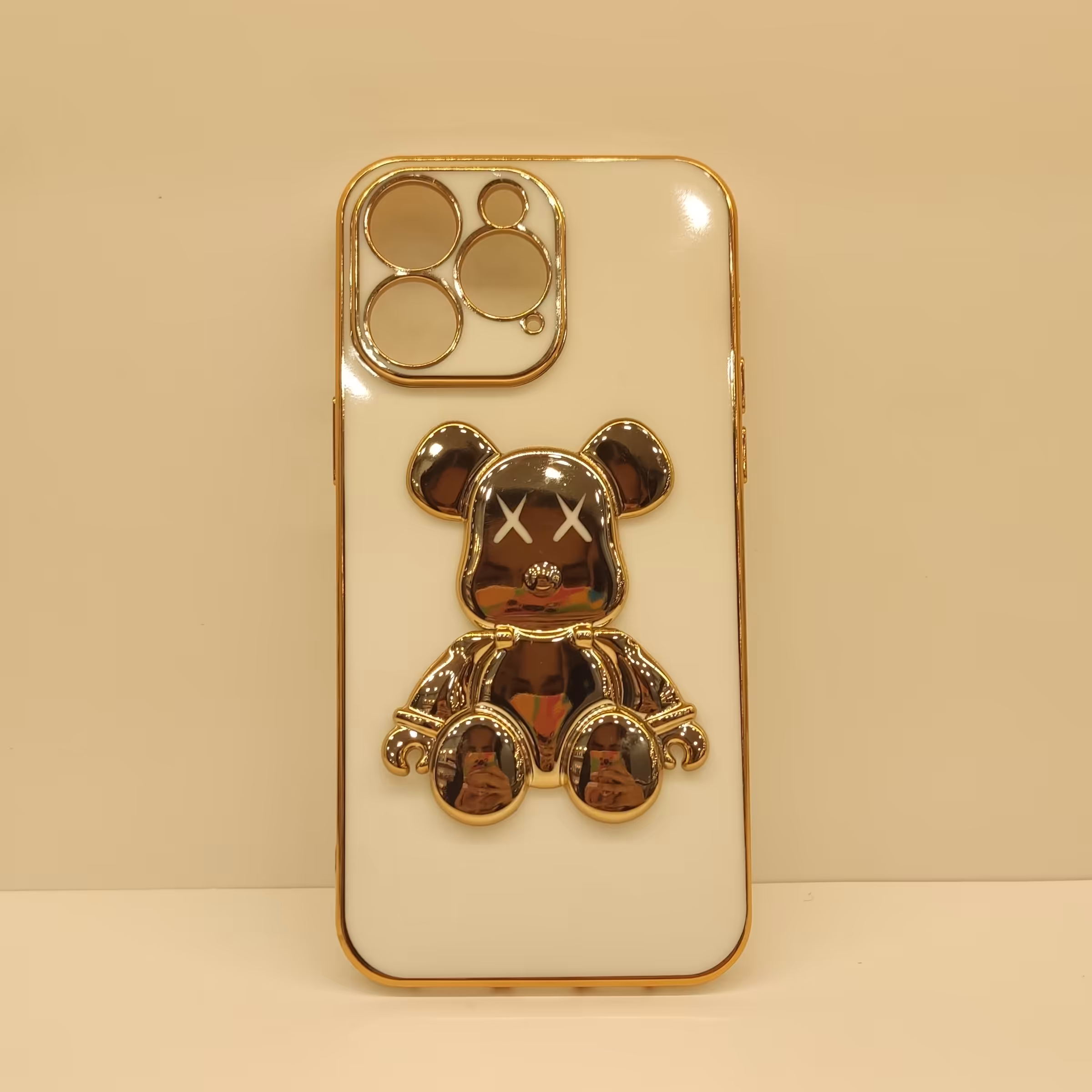 گارد گوشی مدل ایفون 14promax سفید طلایی برجسته استندی