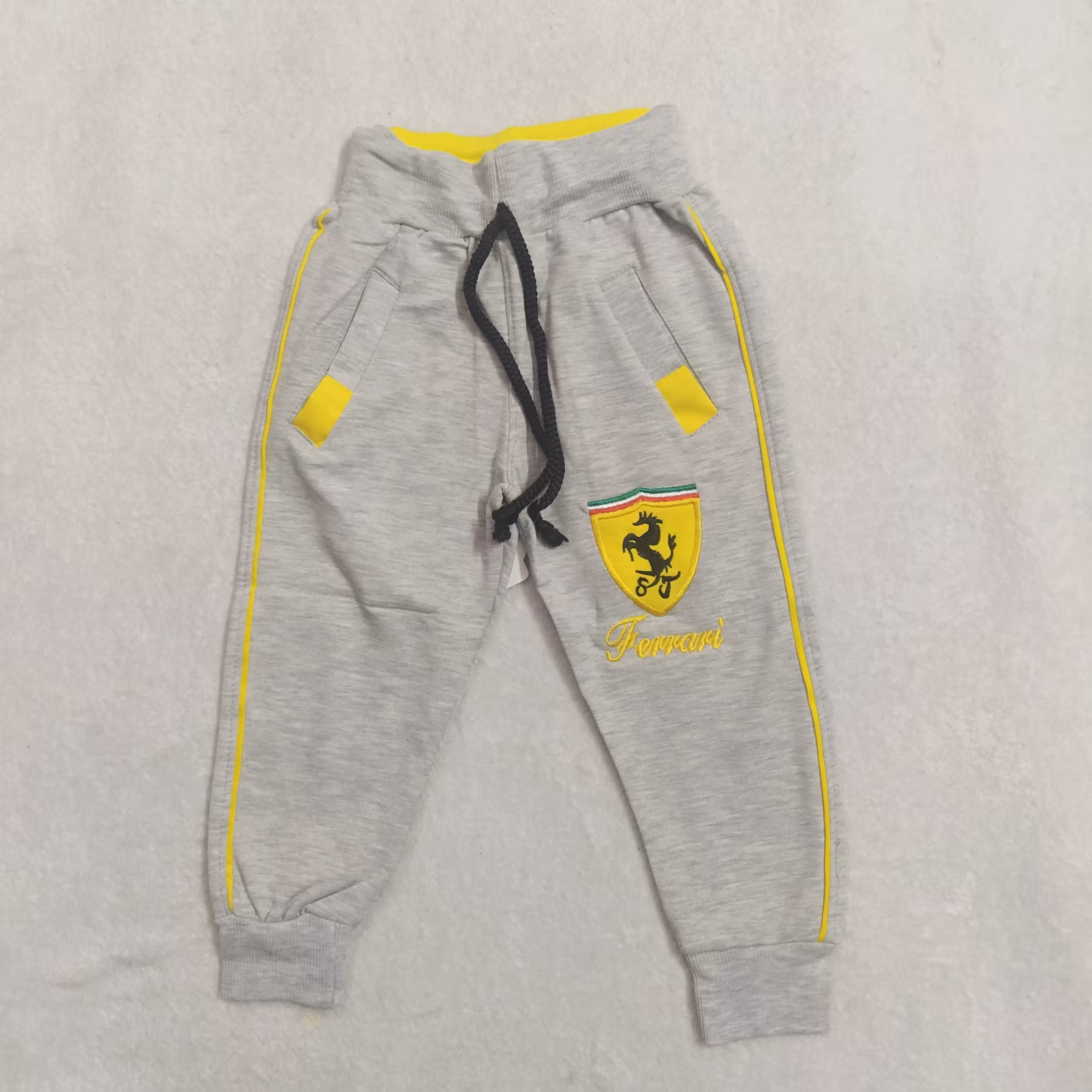 شلوار پسرانه راحتی-طرح نواری زرد-سایز(50و55)