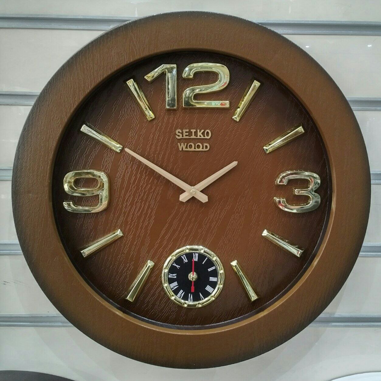 ساعت دیواری سیکو وود موتور آرام گرد، رنگ بندی سفید، قهوه ای جنس بدنه. پلاستیک، قطر 55،