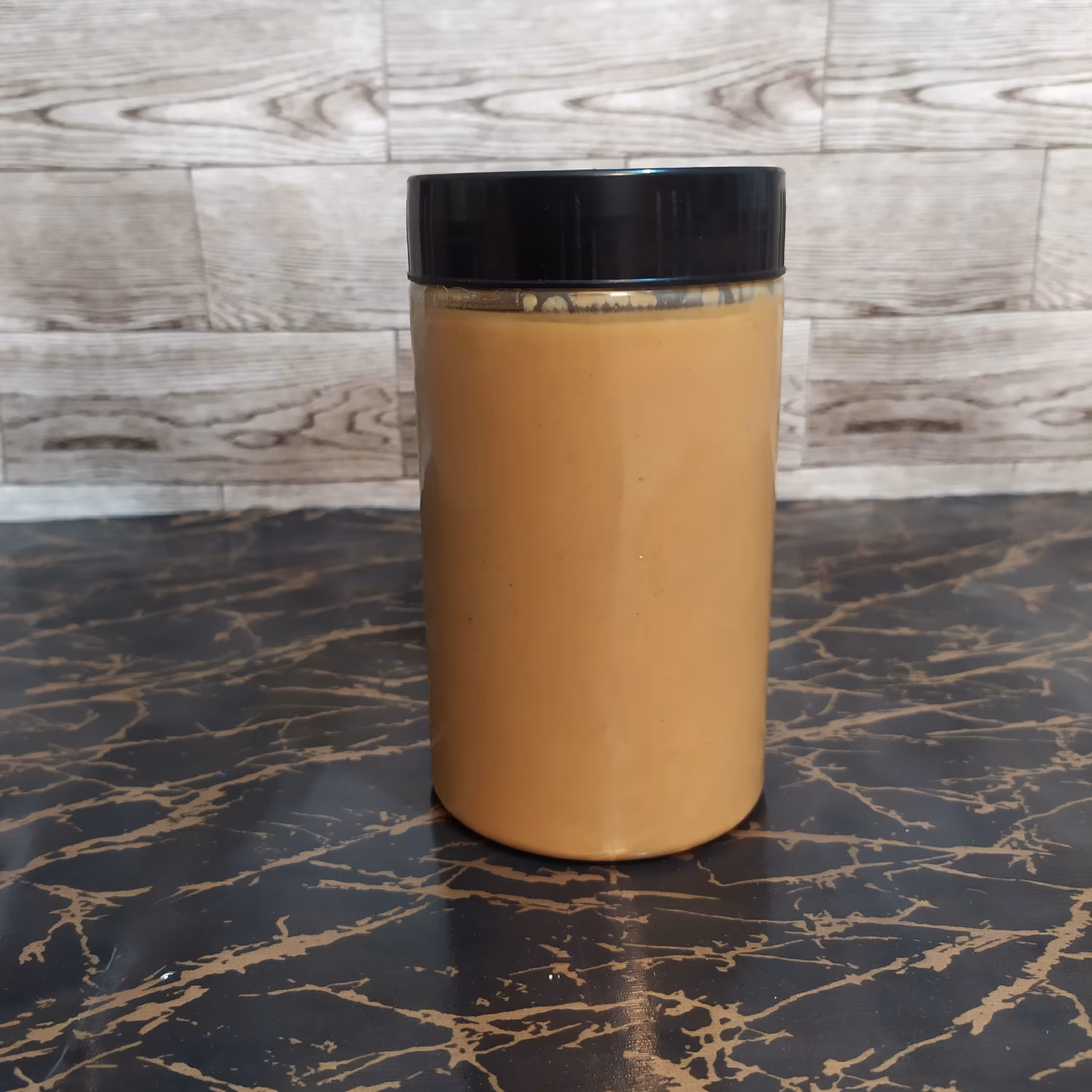 کره بادام زمینی صددرصد خالص و طبیعی بدون هیچ مواد افزودنی (نیم کیلویی)