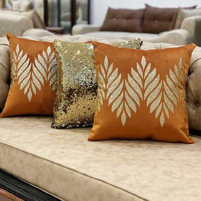 ست کوسن 3 عددی طرح پبچک مخمل نارنجی چرم طلایی اکلیلی 