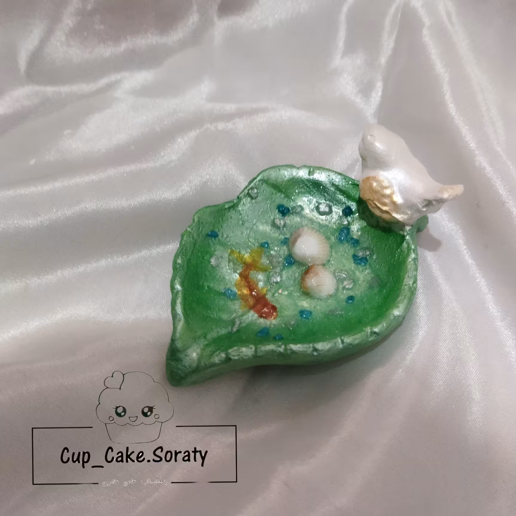 حوض ماهی   طرح برگ و پرنده کوچک