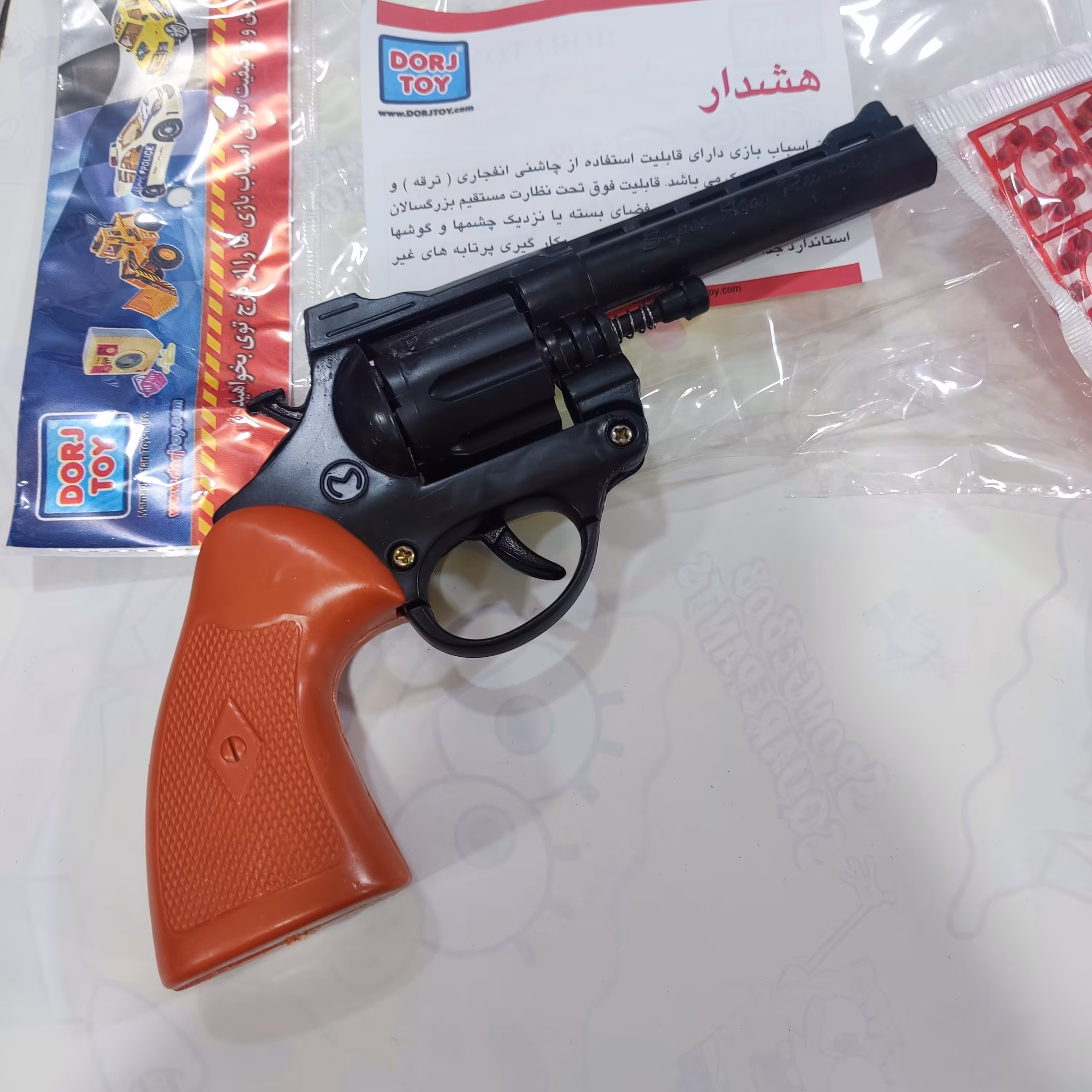 اسباب بازی تفنگ ترقه ای هفت تیر با یک بسته تیر