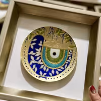 تابلو بشقاب چشم نظر تماما هنردست کارشده با ورق طلا با قاب به ابعاد 23 در 23