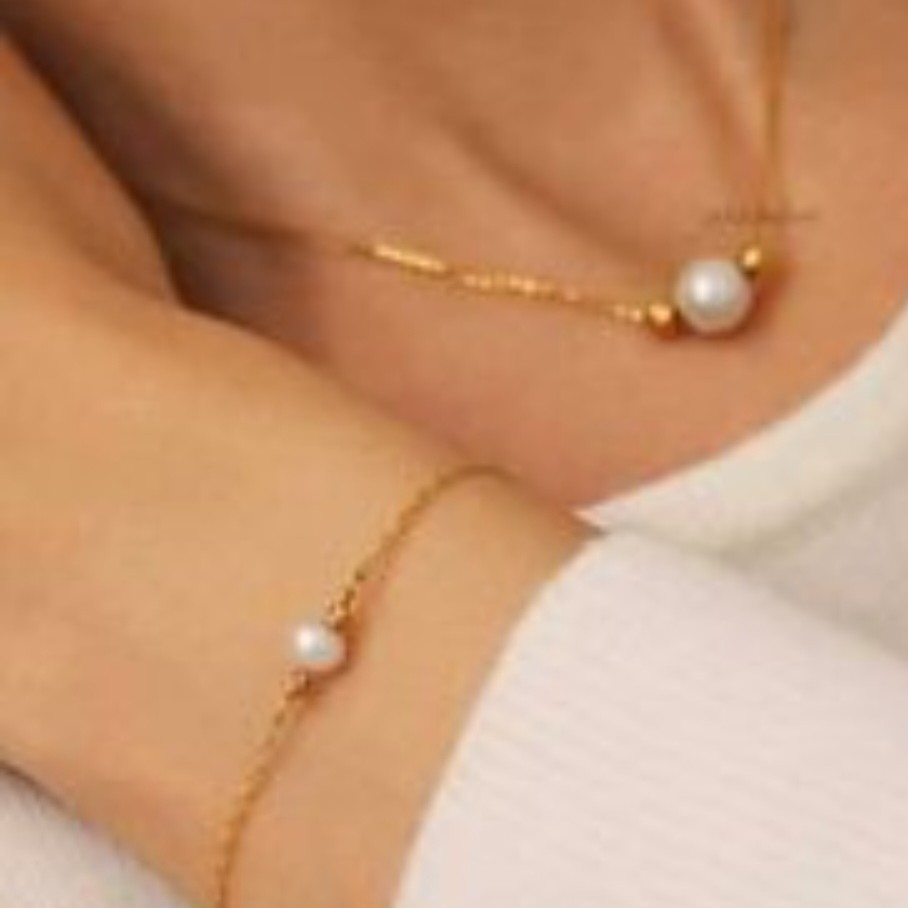 بدلیجات گردنبند و دستبند مروارید و  زنجیر استیل 