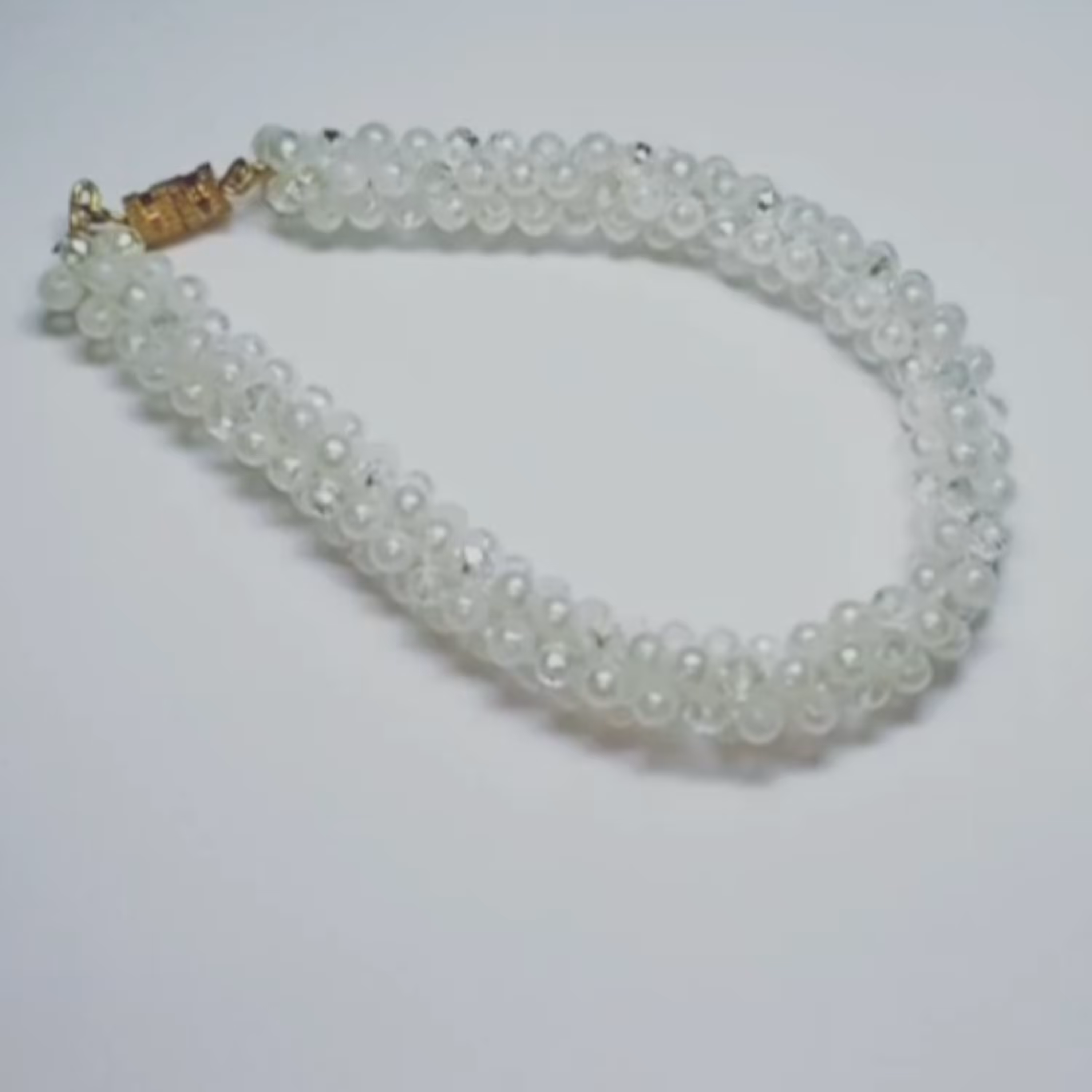 دستبند اسپیرال مهره و مروارید مدل برف 