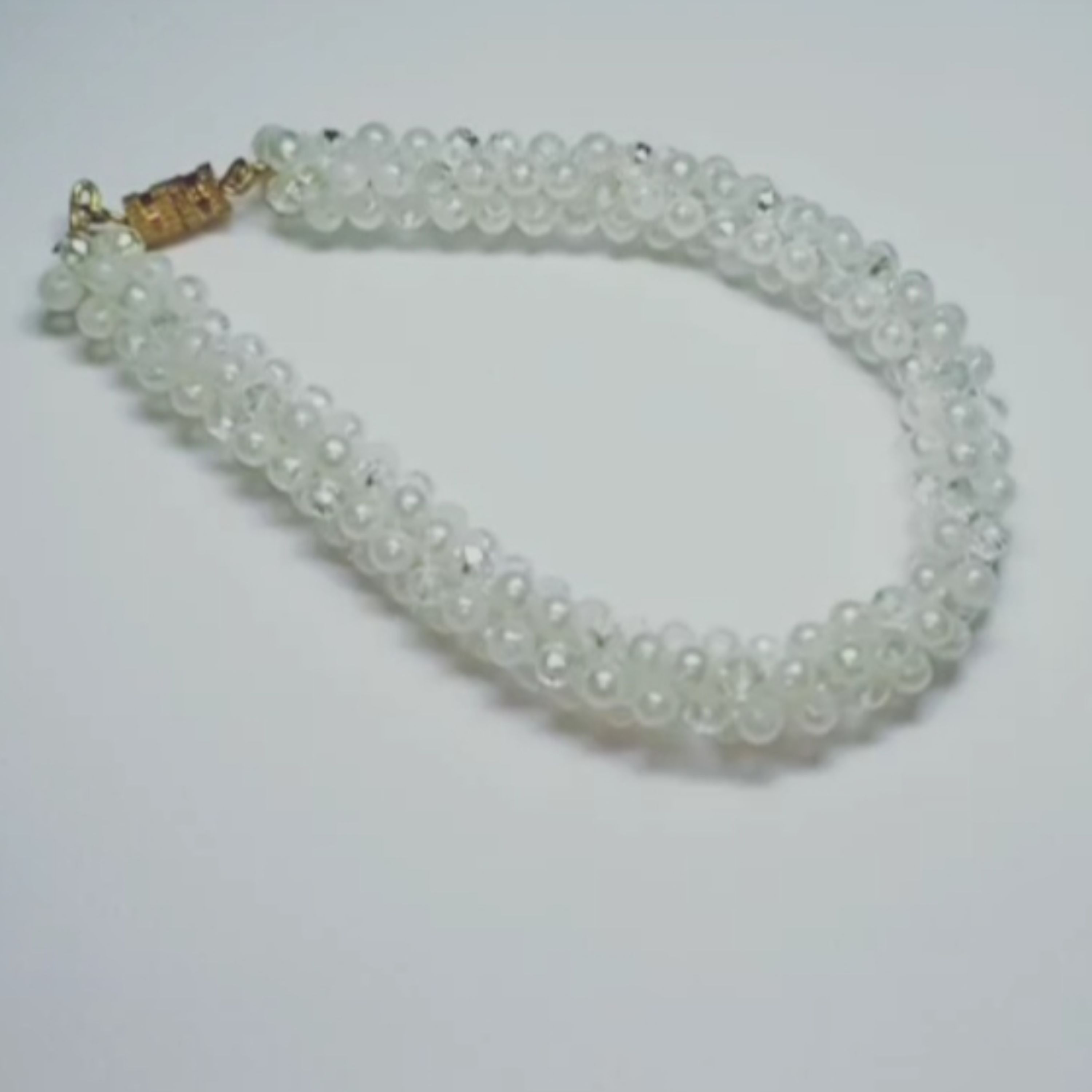 دستبند اسپیرال مهره و مروارید مدل برف 