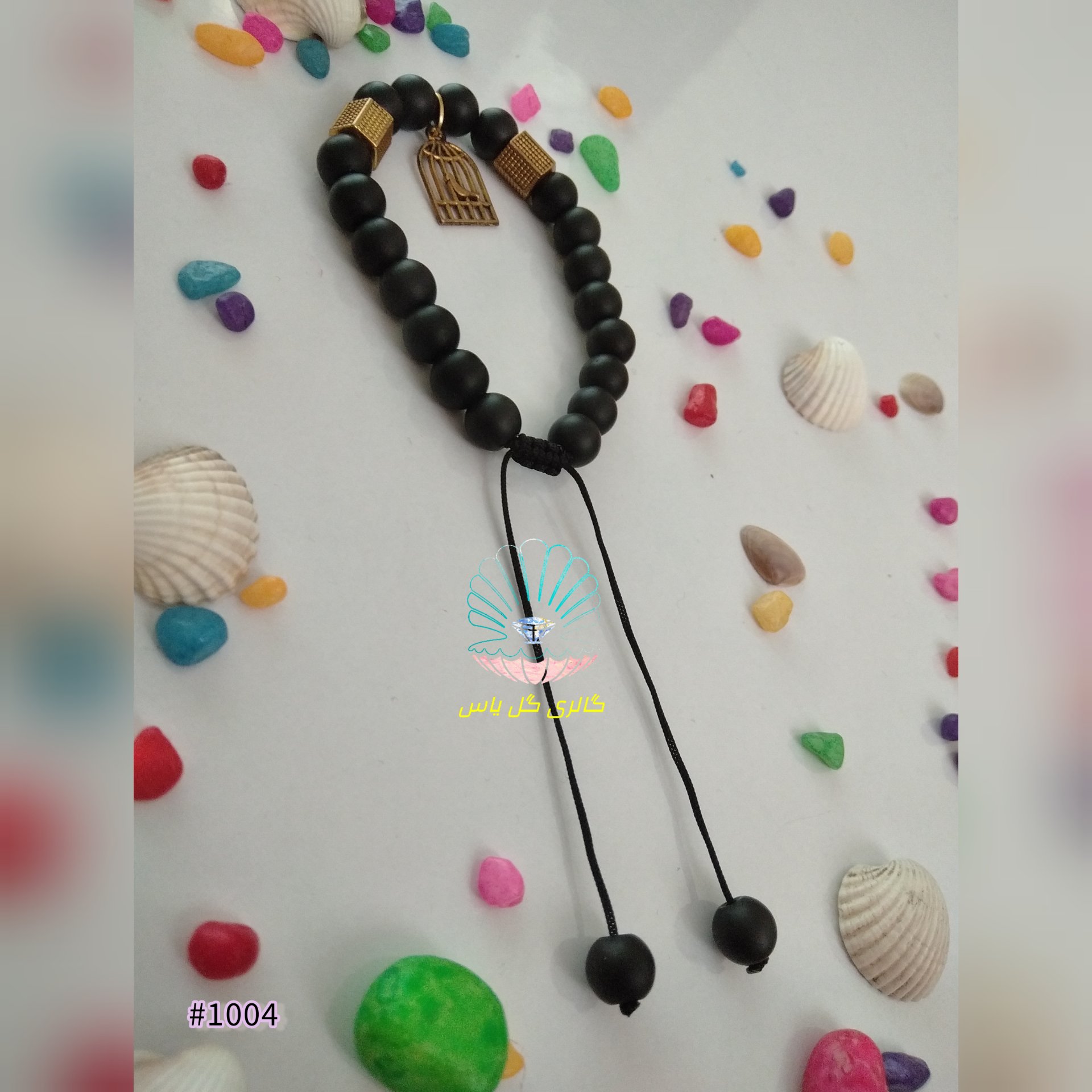 دستبند گره کشویی با مهره اونیکس مشکی و پلاک مرغ آمین 