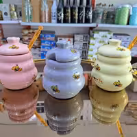 عسل خوری سرامیکی طرحدار همراه با قاشق