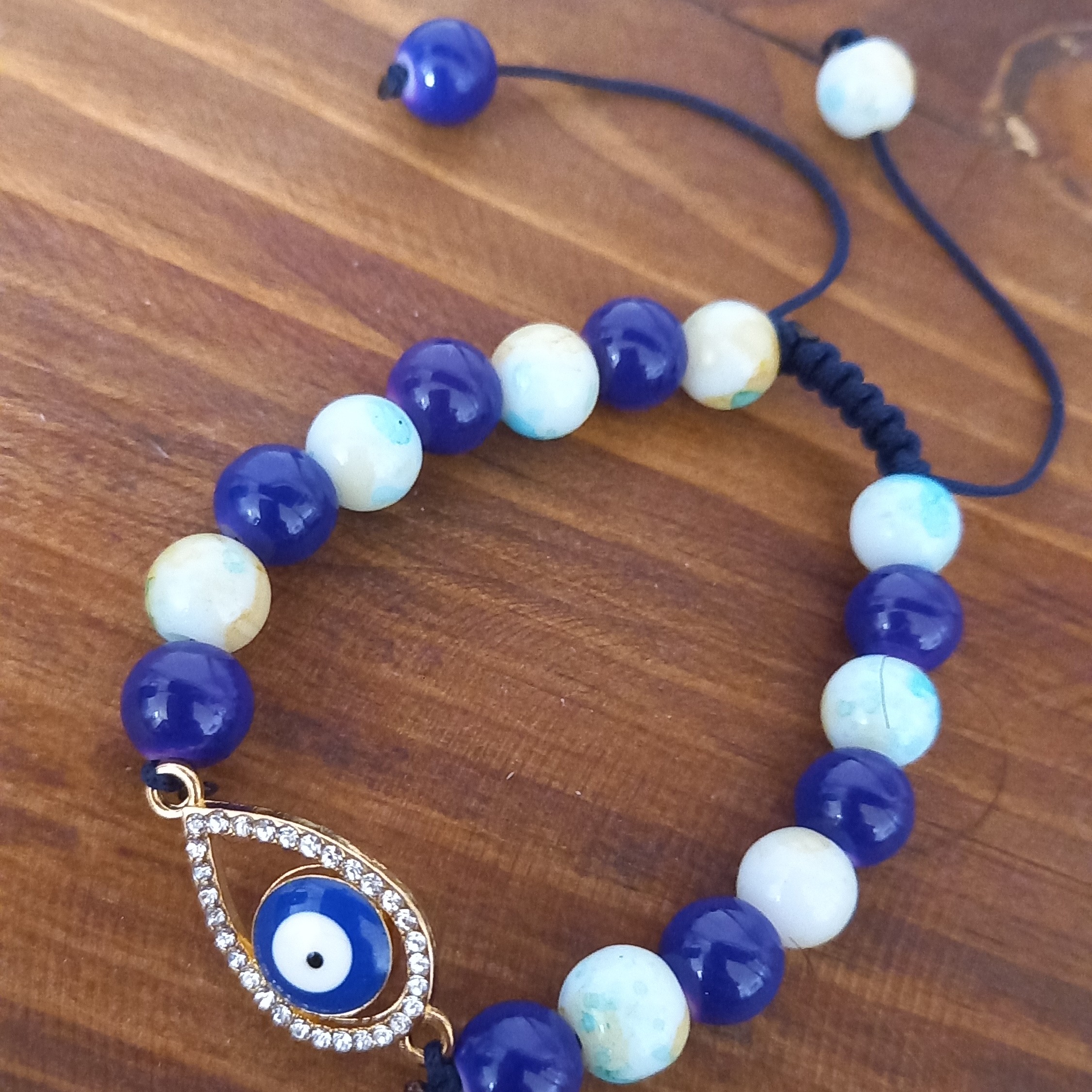 دستبند چشم نظر رنگ ثابت گره کشویی مهره های آبرنگی