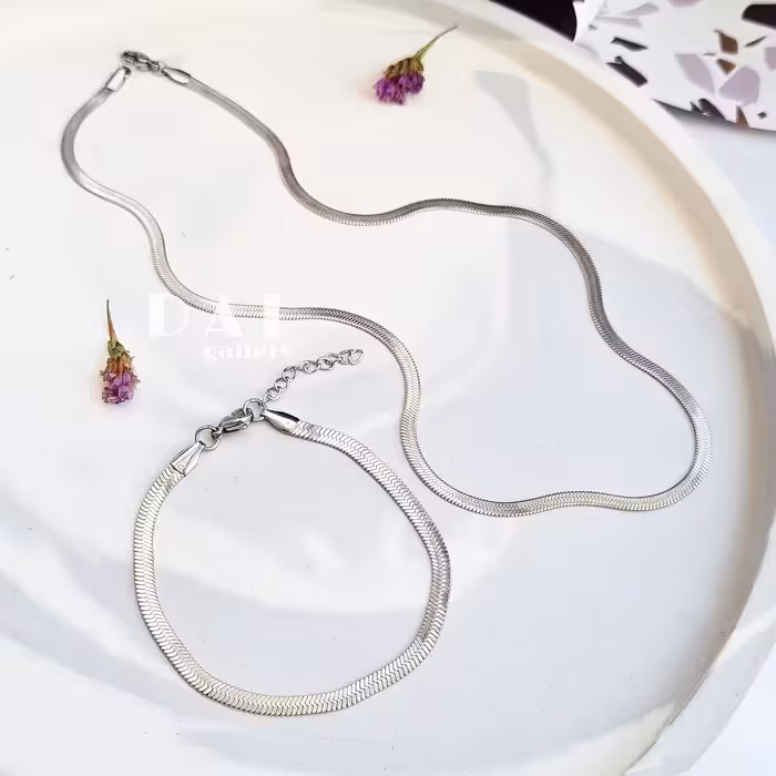 ست گردنبند و دستبندماری نقره ای استیل و رنگ ثابت گردنیند دستبند هرینگبون