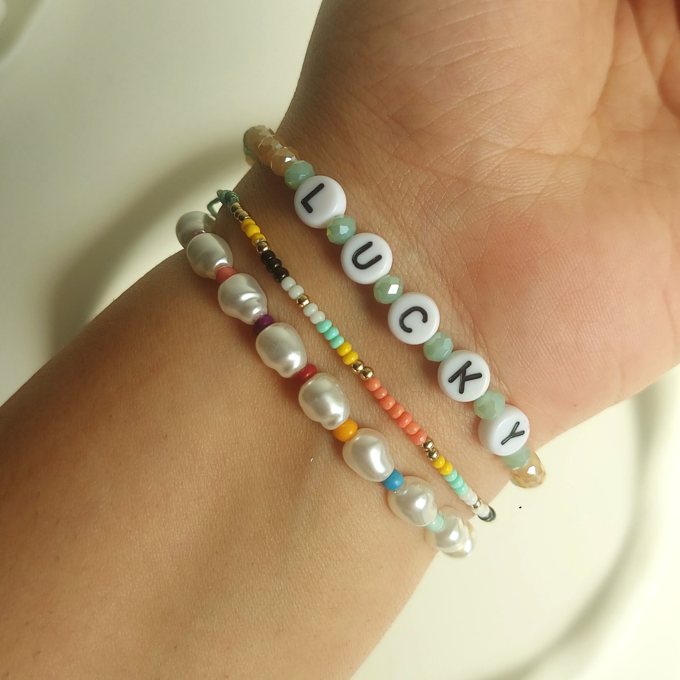 پک دستبند وارداتی مروارید و کریستال رنگی