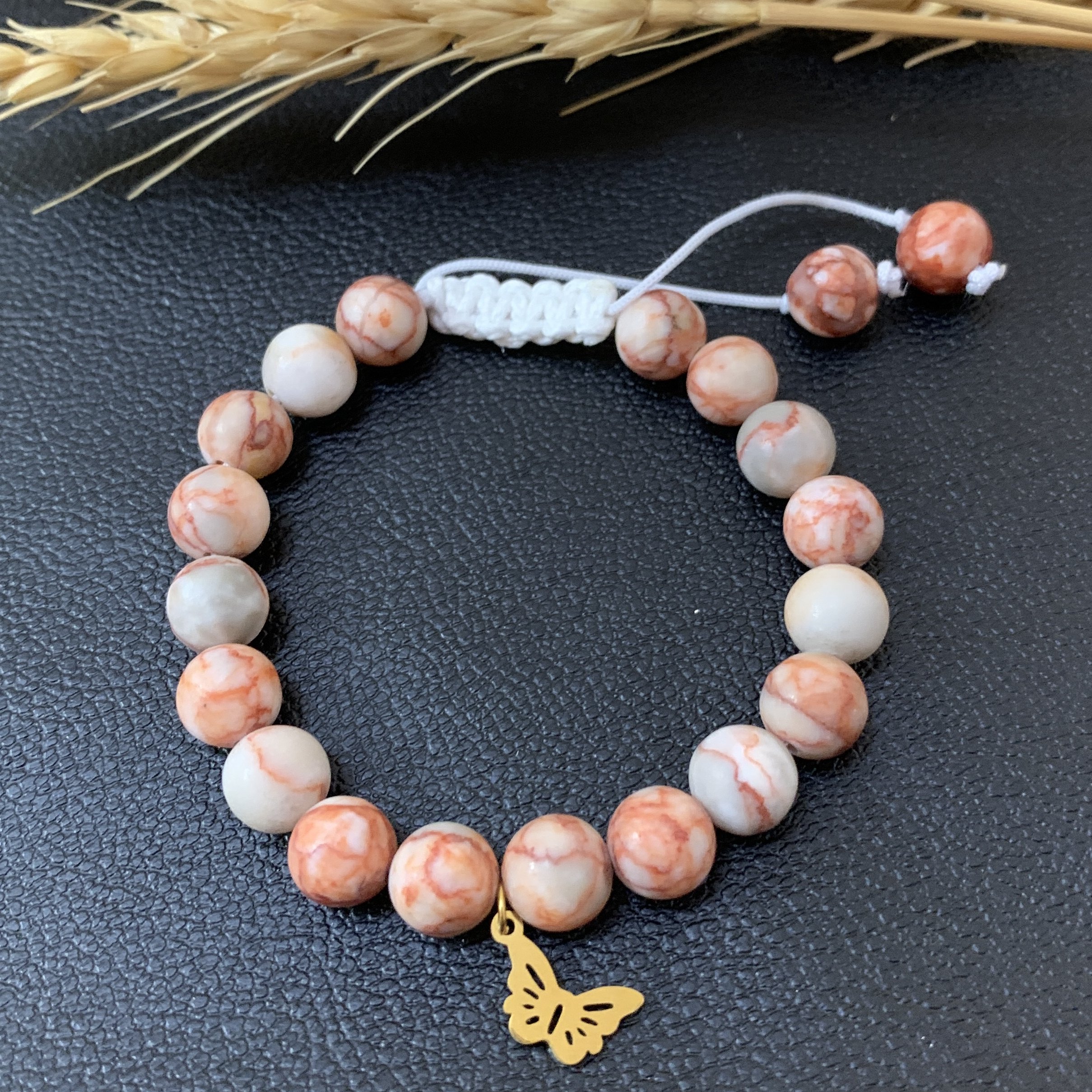 دستبند سنگ جاسپر صورتی با آویز استیل