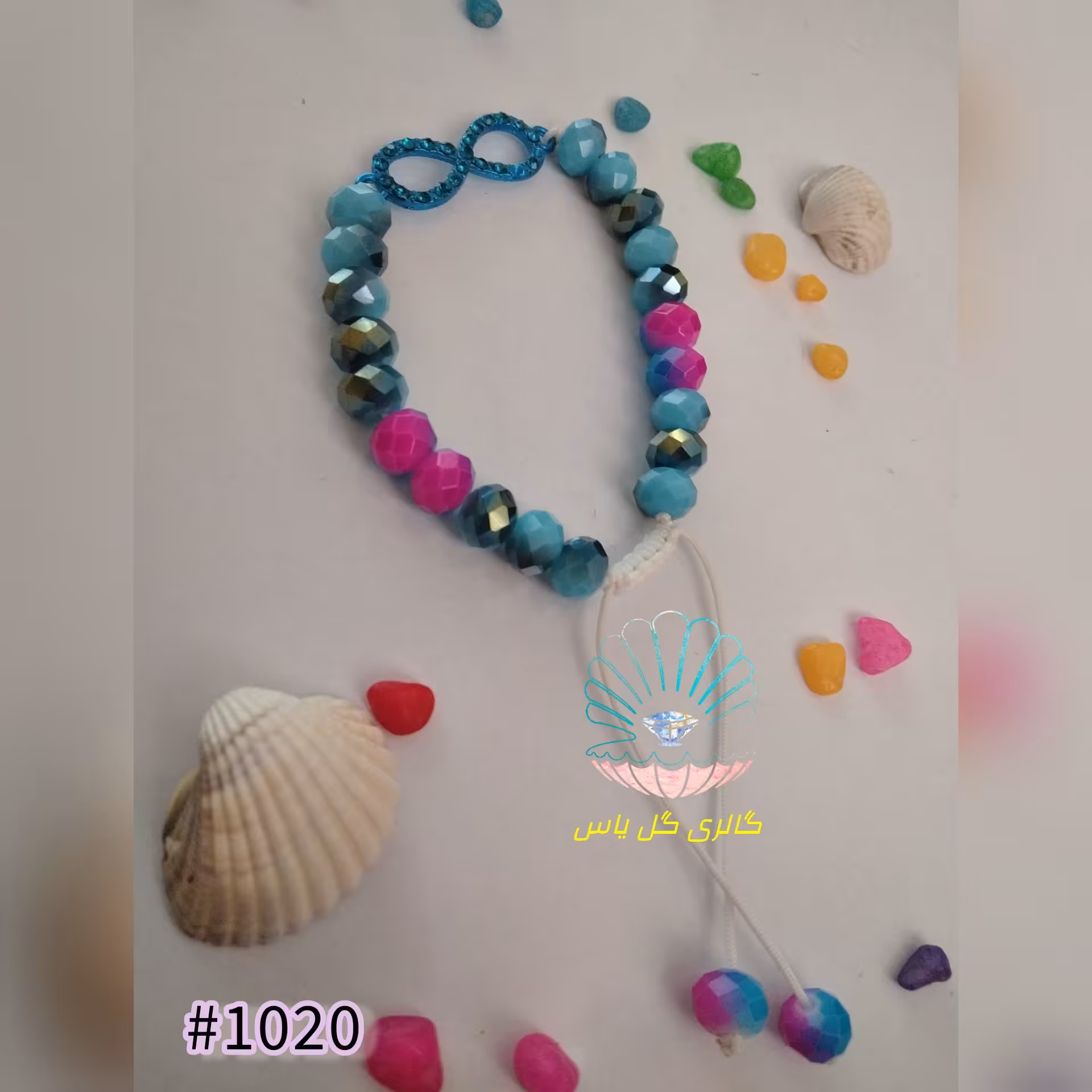 دستبند گره کشویی با مهره کریستالی آبی و بنفش و پلاک بینهایت آبی