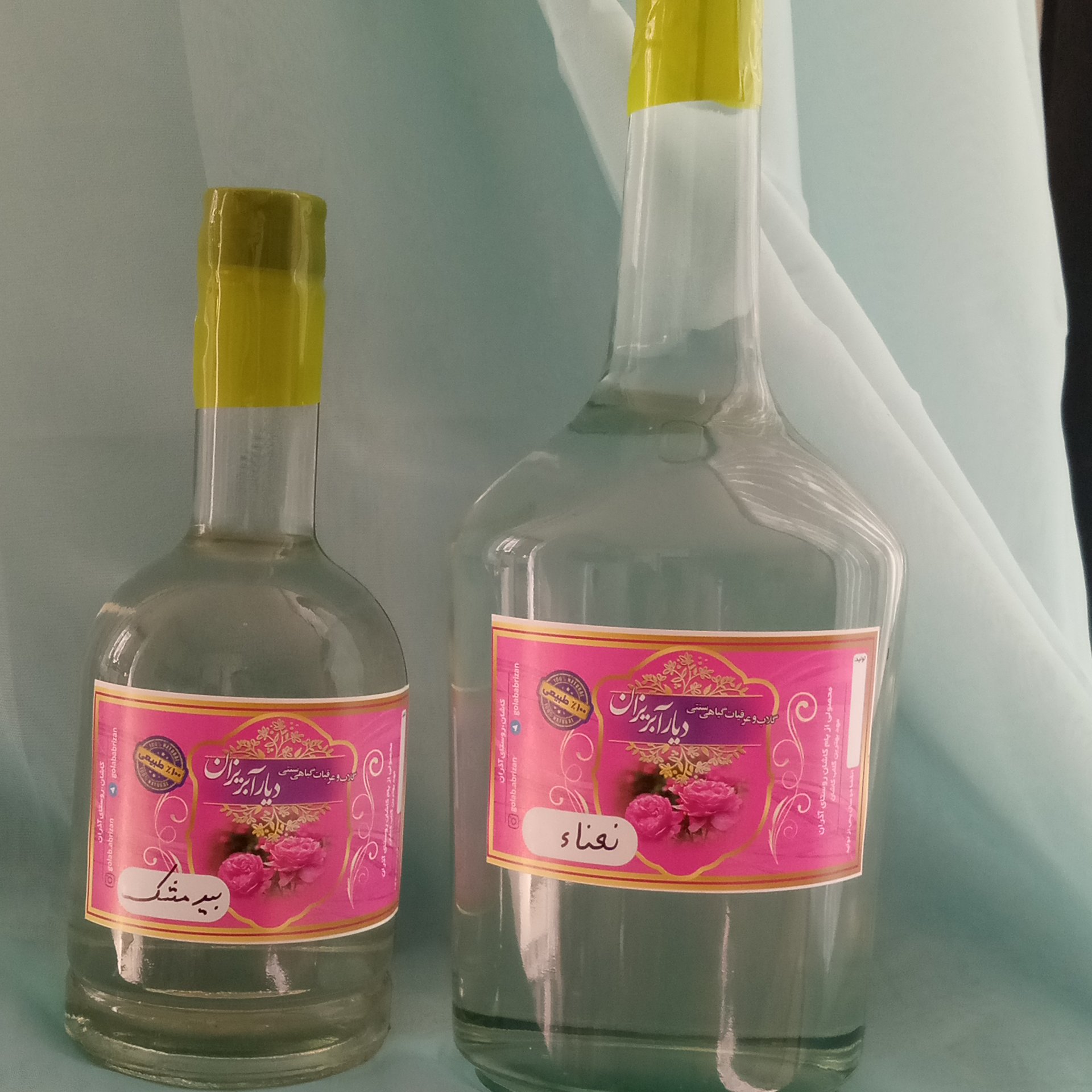 گلاب و عرقیات گیاهی سنتی با بسته‌بندی در بطری شیشه‌ای مناسب کادو و هدایای  تبلیغاتی 