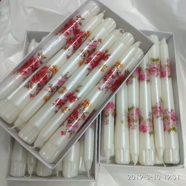 شمع قلمی طرح دار هر عدد25 تومن شمع قلمی 20 سانتی سفید با طرح های بهاری و رندوم