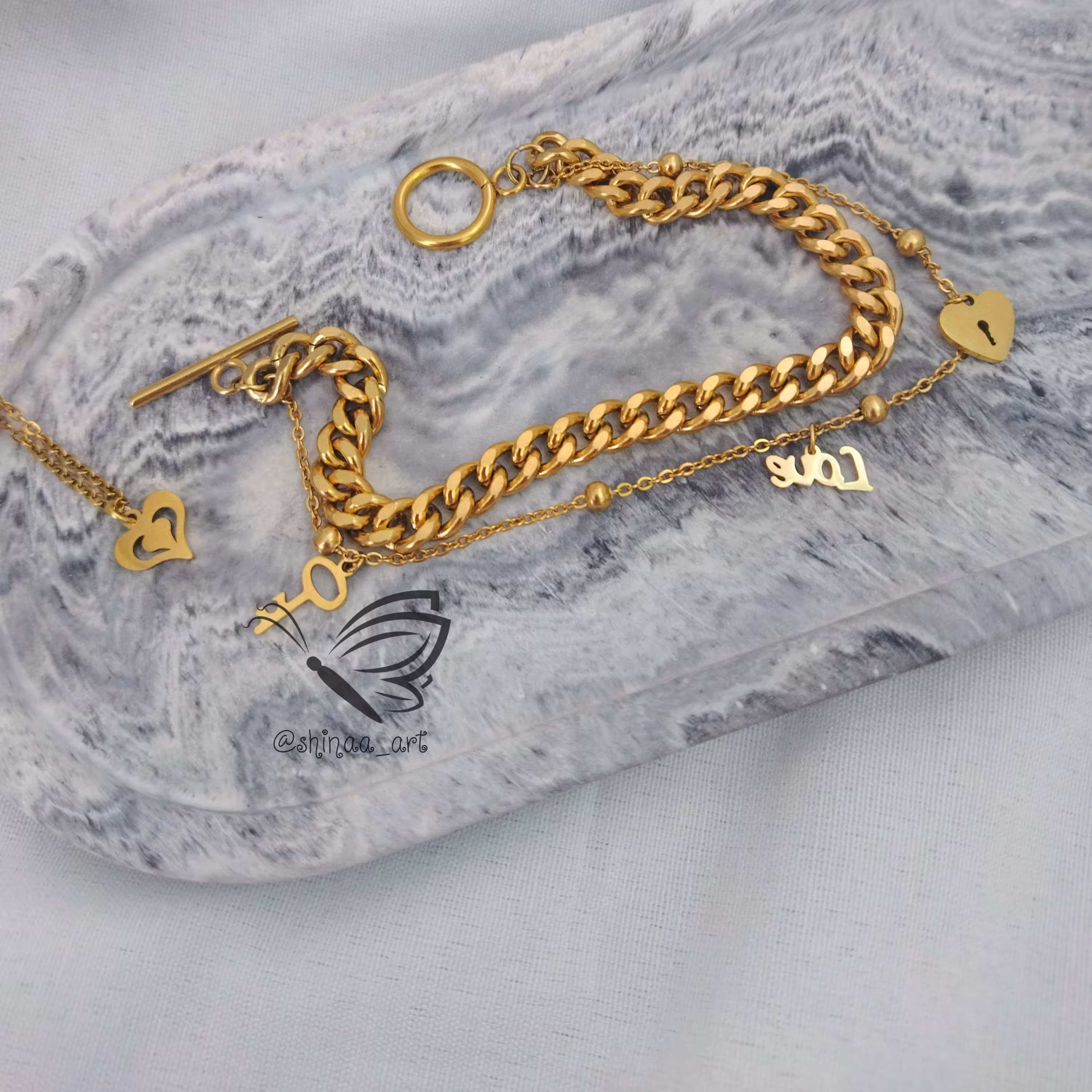 ست دستبند کارتیه دورج و آویز ساعت استیل طرح عشق با آویزهای استیل