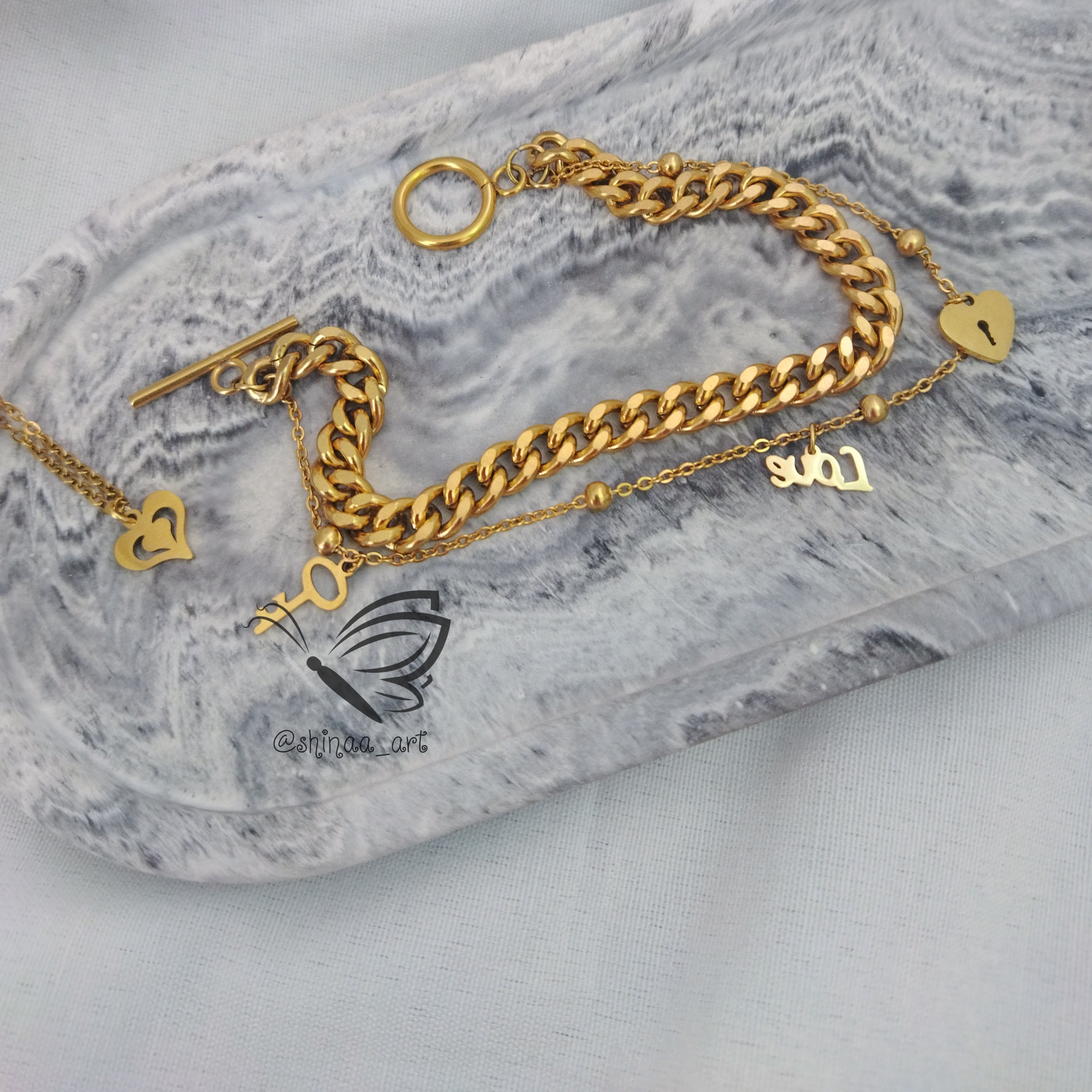 ست دستبند کارتیه دورج و آویز ساعت استیل طرح عشق با آویزهای استیل