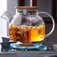 قوری پیرکس شعله مستقیم در بامبو زیره ی درب استیل با کیفیت عالی حجم یک لیتری