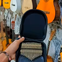 کالیمبا شیشه ایی به همراه هارد کیس و لوازم 