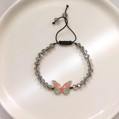 دستبند کریستالی طوسی با خرجکار پروانه هفت رنگ