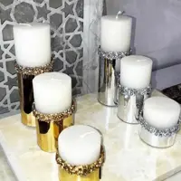 شمع استوانه ای تزئینی نقره ای و طلایی سه عددی 