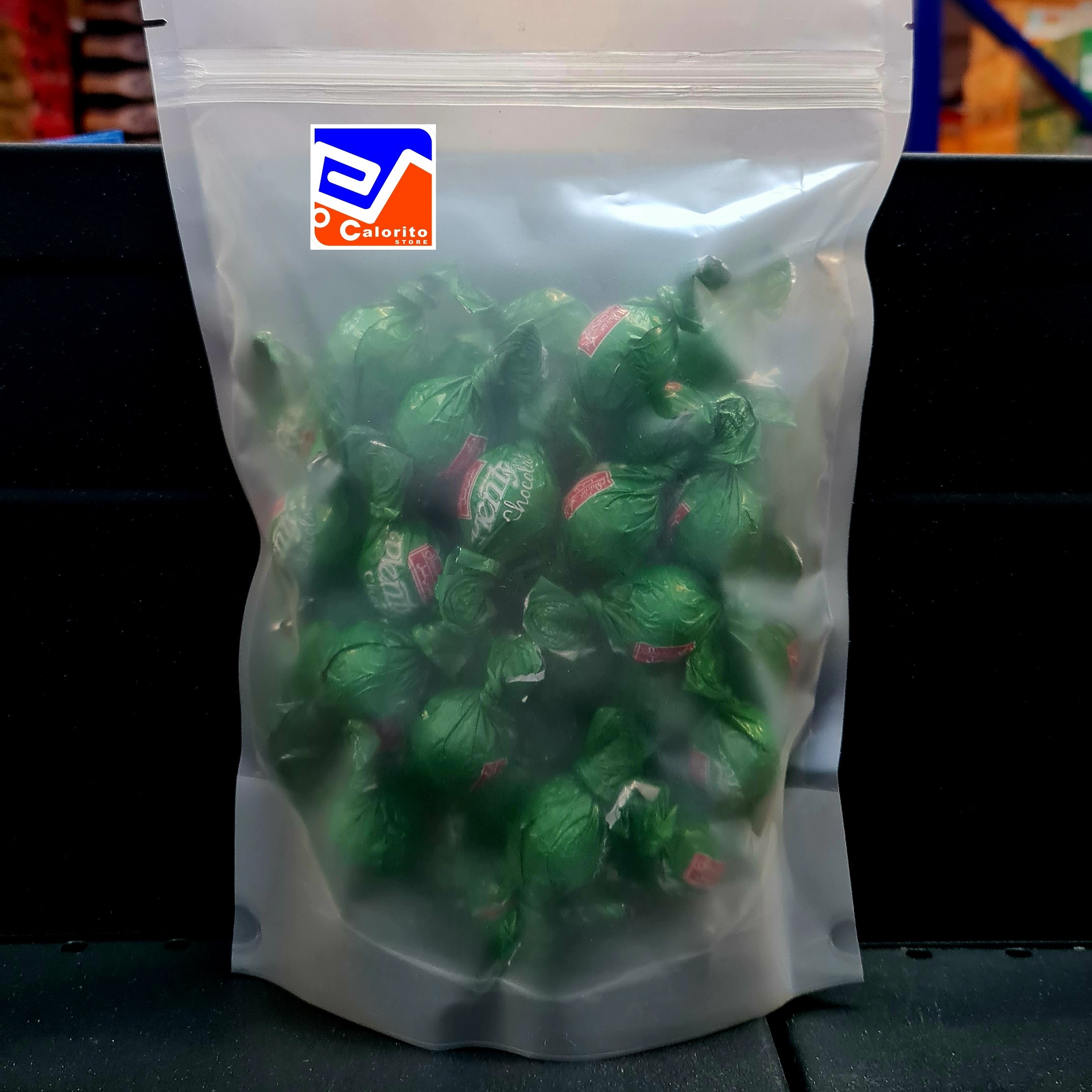 شکلات پلنتی توپی شیری پسته پاکت 500 گرمی