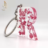 جاکلیدی رزینی حروف انگلیسی گل خشک صورتی حرف R کد 002