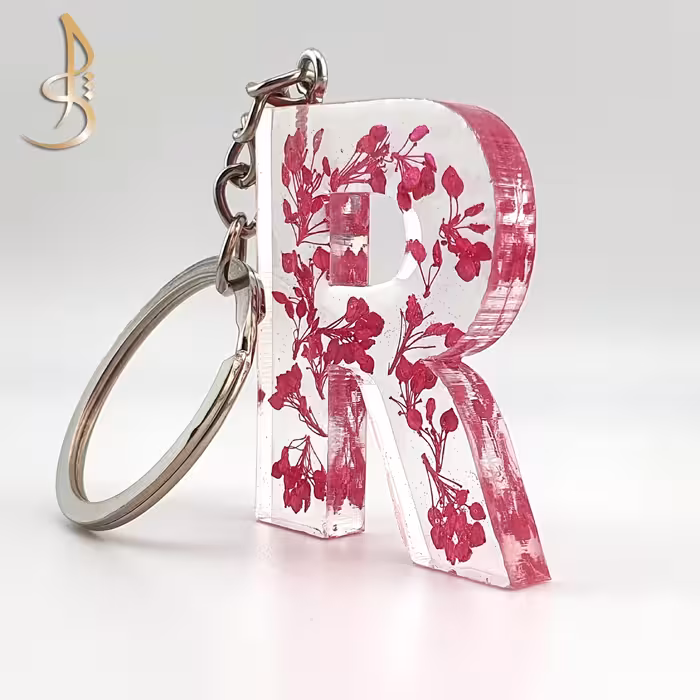 جاکلیدی رزینی حروف انگلیسی گل خشک صورتی حرف R کد 002