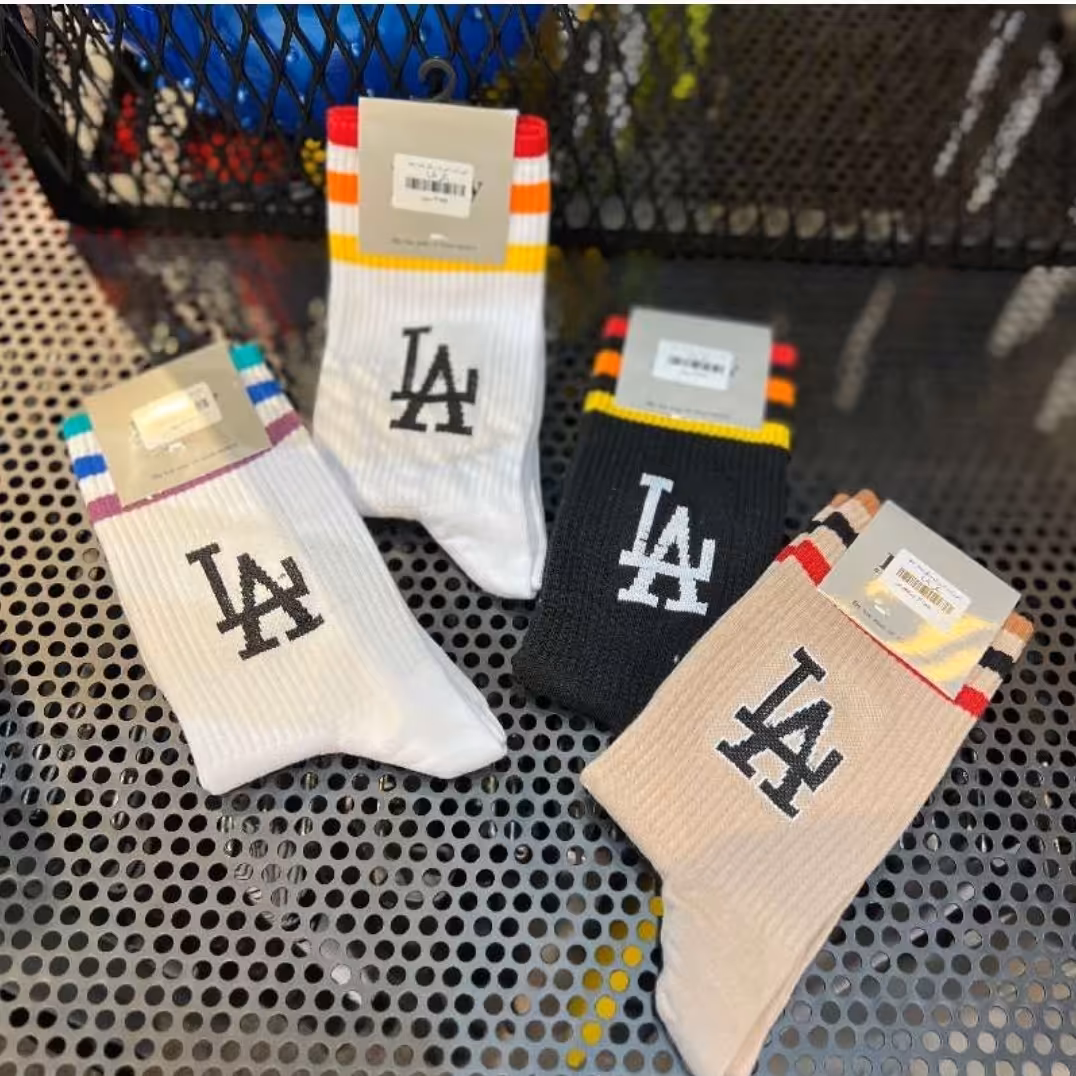 جوراب ساق بلند خط رنگی LA درسه رنگ مشکی،سفیدونسکافه ای  بهترین برند موجود درایران کاراکواسپرت