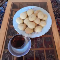 کلوچه پرتقالی  مجموعه 2عددی سایز کوچک 30گرمی باتزئین کنجد تهیه توسط بنده صاحب غرفه خانه شیرینی 