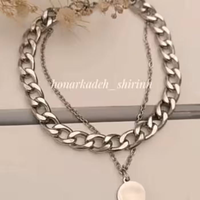 دستبند دو ردیفه ی نقره ای کارتیر با آویز سکه