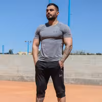 ست تیشرت و شلوارک طرح نمایندگی فول کش  برند اندر ارمور لباس رنگ توسی  ورزشی کاراکو اسپرت